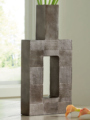 this vase-'s contemporary geometric form acts as a captivating focal point for your mantle or bookshelf. Its antiqued nickel-tone body is detailed with subtle texture for added visual appeal. What a perfect fit for those seeking 