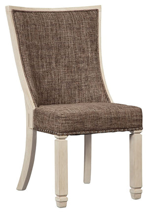 The beauty of this upholstered dining chair is something to savor. Contoured seat cradles you in cushioned comfort while lattice peekaboo detail on the back makes this a striking chair from all angles. Heavy woven fabric adds textural interest that comple