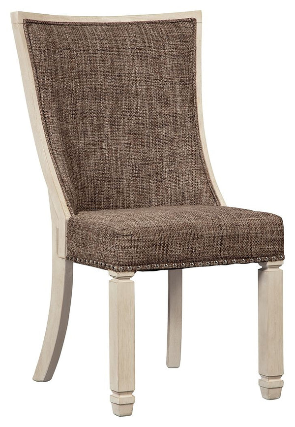 The beauty of this upholstered dining chair is something to savor. Contoured seat cradles you in cushioned comfort while lattice peekaboo detail on the back makes this a striking chair from all angles. Heavy woven fabric adds textural interest that comple