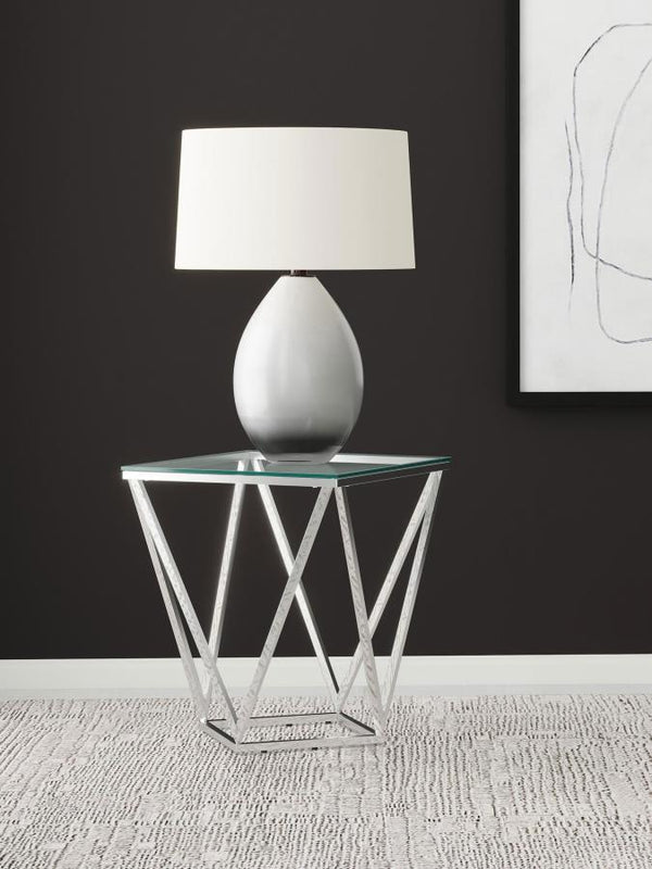  flared triangles in metal with a gleaming nickel finish