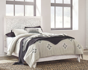 Your young trendsetter can live out her free spirit with this uniquely chic queen bed. Exquisite carved medallion pattern is a testament to true style. Charming whitewashed finish sets a foundation for a room bursting with personality. Headboard legs have