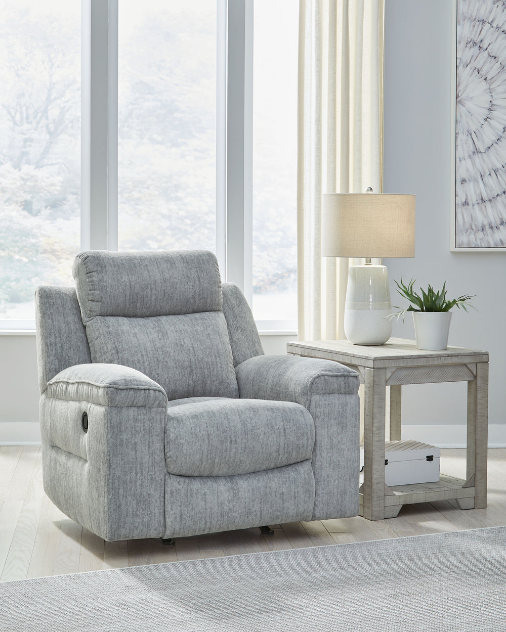 This budget-friendly rocker recliner makes it so easy to stream a new series or nap for a good, long time. Sumptuous on-trend textured upholstery, plump cushioning and simple pull tab reclining make it the best seat in the houseâ€”all that-'s missing is y