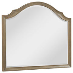 This French Provincial-inspired dresser mirror enhances the elegance of any bedroom. Framed in solid poplar, engineered wood, and mango veneer, it features a washed mango finish that highlights its refined craftsmanship. The gracefully curved silhouette c