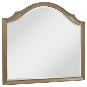 This French Provincial-inspired dresser mirror enhances the elegance of any bedroom. Framed in solid poplar, engineered wood, and mango veneer, it features a washed mango finish that highlights its refined craftsmanship. The gracefully curved silhouette c