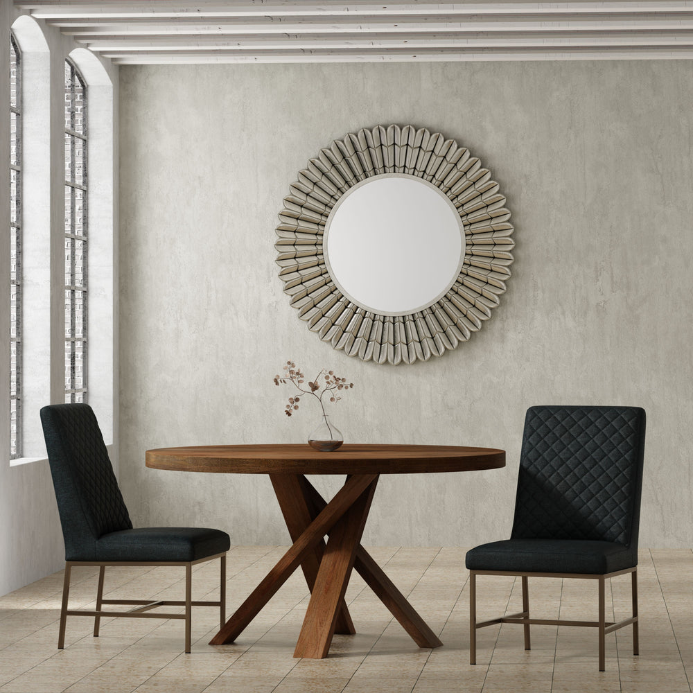 Bring a touch of global-inspired elegance to your dining room with the 60 Inch Round Dining Table. This handcrafted table is made from solid mango, giving it a unique aesthetic with natural variations of color, wood grain, and knots. The round table is pa