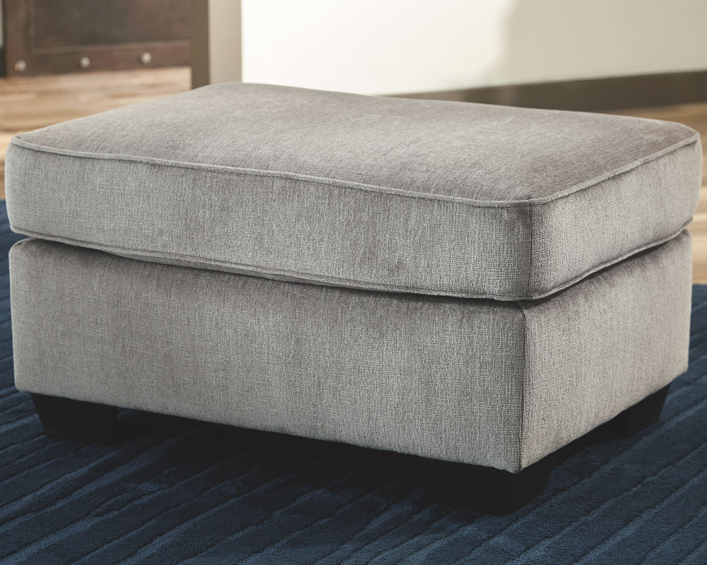 If style is the question, then this striking ottoman is the answer. Its decidedly contemporary profile is enhanced with plump cushioning and a chenille-feel upholstery that-'s so pleasing to the touch. Rest assured, this ottoman in richly neutral alloy is