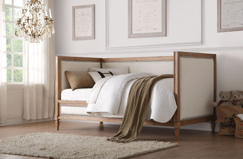 The Charlton daybed will add a beautiful addition to you classic living room, family room, or bedroom. The daybed offers a rustic design that is framed by salvage oak finish and upholstered by cream linen accented by nailhead trim. Conveniently providing 
