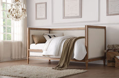 The Charlton daybed will add a beautiful addition to you classic living room, family room, or bedroom. The daybed offers a rustic design that is framed by salvage oak finish and upholstered by cream linen accented by nailhead trim. Conveniently providing 