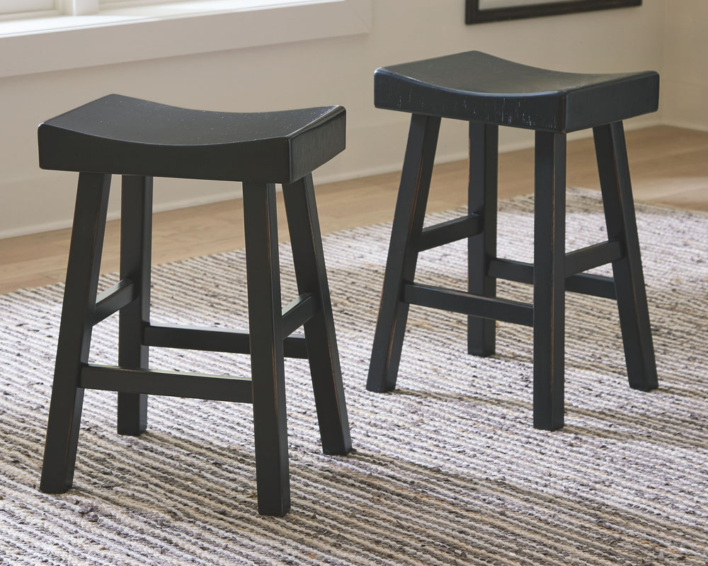 Saddle up and prepare to feast in total comfort and style. This counter height saddle stool-'s deeply scooped seat offers ample support through multiple courses (or rounds of drink). Contrasting finishes elevate the classic shape, creating a look that kee