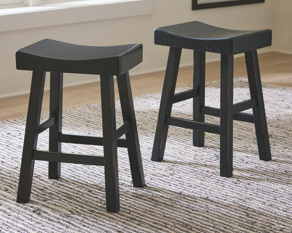 Saddle up and prepare to feast in total comfort and style. This counter height saddle stool-'s deeply scooped seat offers ample support through multiple courses (or rounds of drink). Contrasting finishes elevate the classic shape, creating a look that kee