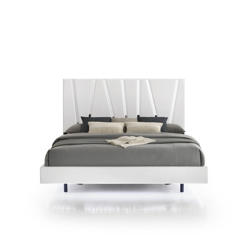 The Europa Panel Bed in white offers a perfect blend of modern elegance and quality craftsmanship. This set includes a panel headboard, footboard, two side rails, and four mattress support slats. Its sleek design is achieved with a majestic headboard, glo