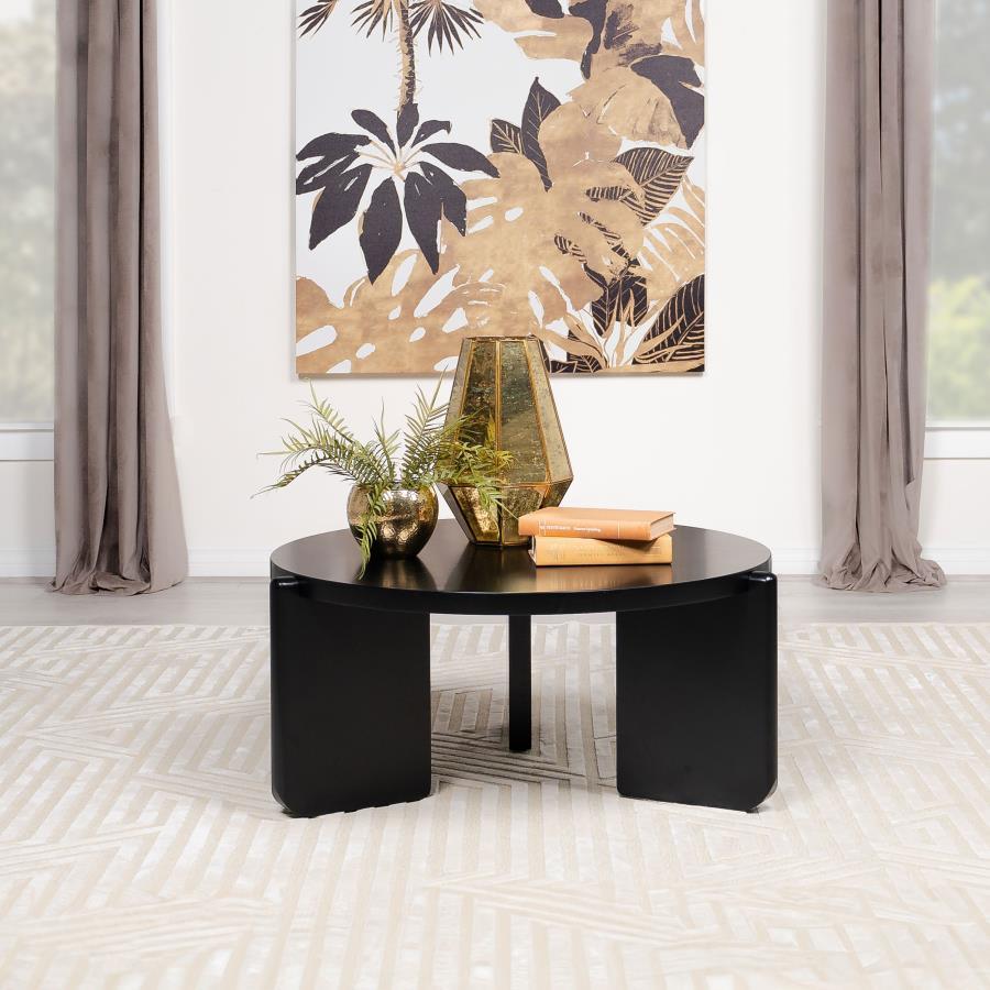 The coffee table, a focal point in your living area, is both a gathering place and a showcase of solid wood artistry. Its circular form softens spaces, inviting conversation and connection. The substantial silhouette of this cocktail table speaks of its r