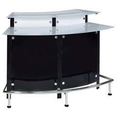 Entertain in sleek sophistication with this modern home bar, featuring a curved silhouette, chrome accents, and glossy black and white acrylic panels. Dual-tiered frosted glass tops offer ample space for mixing and serving, while the metal footrest invite