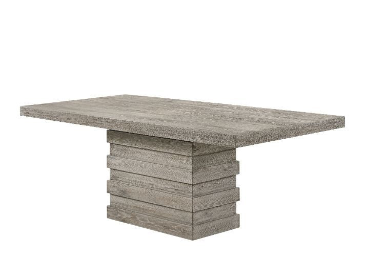 Impress all your guests during your next dinner party with this Faustine dining collection. The dining table strikes a clean-lined silhouette and boasts a single pedestal base for a contemporary style touch. It is a salvaged light oak finish that is versa