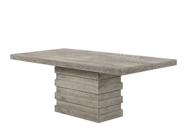 Impress all your guests during your next dinner party with this Faustine dining collection. The dining table strikes a clean-lined silhouette and boasts a single pedestal base for a contemporary style touch. It is a salvaged light oak finish that is versa