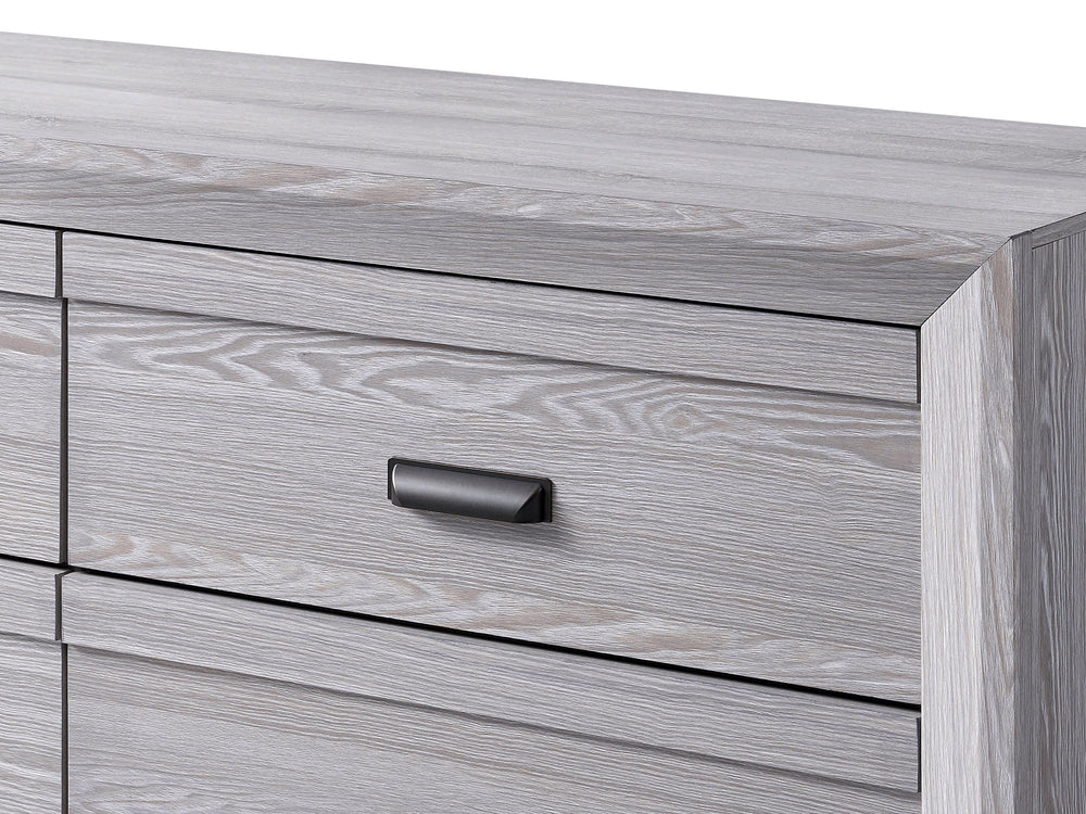 This bedroom set is the embodiment of understated sophistication, featuring a neutral drift wood finish that complements its clean and contemporary design. The robust bed frame anchors the room with a sense of sturdiness and style. Accompanying the bed ar
