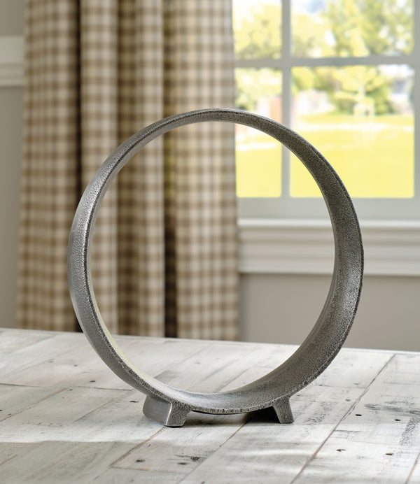  this sculpture rounds out your decor in sleek style. The antiqued pewter-tone finish has a chic appeal that remains versatile