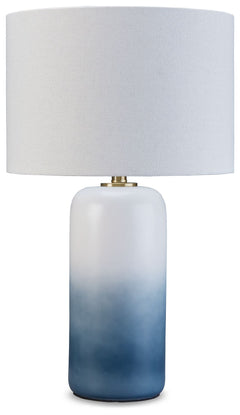 A dramatic ombrÃ© design defines this table lamp. Crafted of ceramic, it features broad, saturated bands of color that gradually fade to white toward the top. A natural fabric shade extends the tonal gradation and provides a tailored finishing touch.<br><
