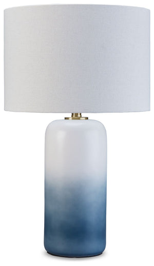 A dramatic ombrÃ© design defines this table lamp. Crafted of ceramic, it features broad, saturated bands of color that gradually fade to white toward the top. A natural fabric shade extends the tonal gradation and provides a tailored finishing touch.<br><