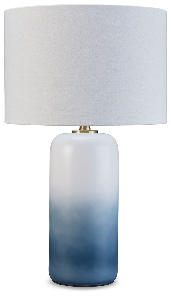 A dramatic ombrÃ© design defines this table lamp. Crafted of ceramic, it features broad, saturated bands of color that gradually fade to white toward the top. A natural fabric shade extends the tonal gradation and provides a tailored finishing touch.<br><