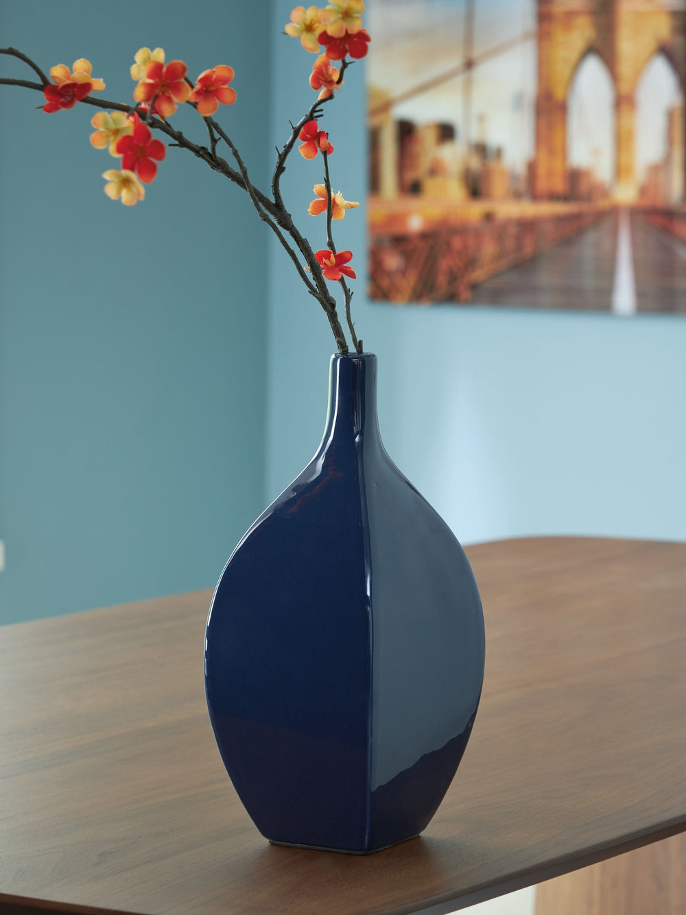 This vase is an effortless display of versatile style. Its navy blue hue makes a chic statement, whether hosting faux florals or standing alone. Sprucing up your outdoor oasis? The vase is durable enough for alfresco use, so you can add decorative flair w