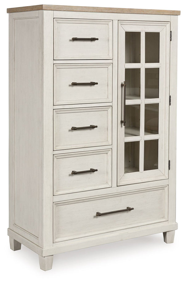 This door chest elevates the art of modern farmhouse design. Its two-tone aesthetic blends antiqued white and light grayish brown for a charming finish. Framed drawer fronts and a windowpane door lend a country feel. Conveying a feeling of relaxed comfort