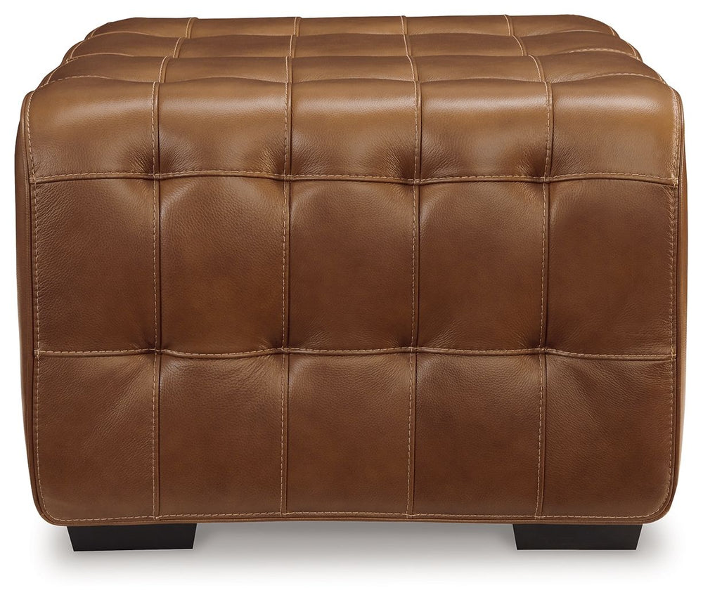 A mid-century modern update to a retro classic, this ottoman is generously adaptable. Its combination of skillfully matched leather and faux leather upholstery exudes luxury and elegance. The cushion-'s dramatic tufting beckons you to kick back and relax.