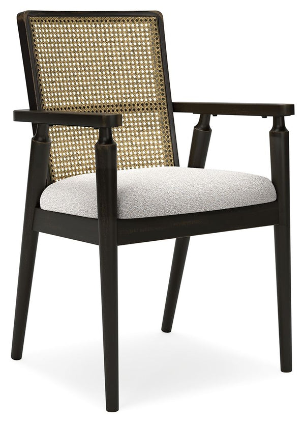  with a faux cane backrest incorporating eye-catching texture. And the chairâ€™s color palette is stunningly simple