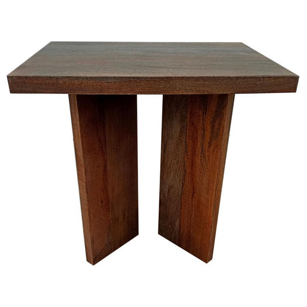 In the embrace of unadorned beauty, this end table stands with a rustic charm that echoes the soul of the wilderness. Solid mango wood, crafted from large and enduring planks, brings a touch of the untamed forest into the home. Its raw and robust design h