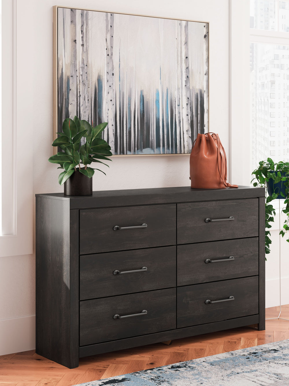 This dresser puts a casually chic twist on everyday function. Its rustic charcoal finish pairs well with other neutrals and pops of color alike, giving you the flexibility to change up your aesthetic as you please. Smooth-gliding drawers keep clothes and 