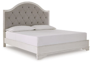 Traditional design. Casual appeal. You can have it all with this king upholstered panel bed. A relaxed chipped white finish and an inset headboard cushion with classic button tufting give the distinctive piece an allure all its own. And the low-profile si