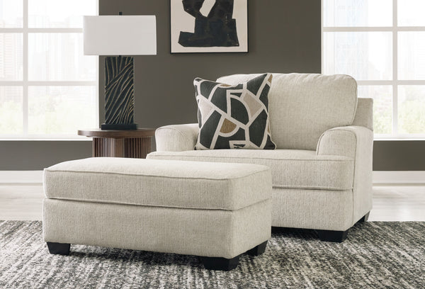 Embrace effortless elegance with this oversized chair and ottoman set. Its clean lines and curved details are right at home in contemporary settings. Stressed about styling? The neutral hue easily pairs with your existing color palette. From morning coffe