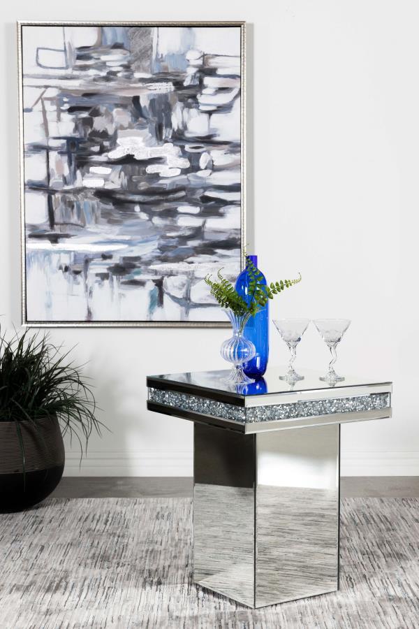  modern glam accent table. A square table sits on a tall square pedestal for an edgy