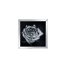 The Nevina crystal wall mirror is sure to be the focal point of any room. Dramatically cast with a rose shaped mirror that is the perfect contrast against a black background. Faceted optic glass crystals adorn the skill layering it with added luxe and bri