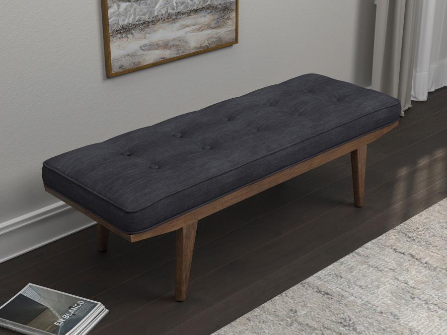 Perfect for a bedroom or entryway, this wooden bench is crafted for comfort and style. The attached seat cushion gives you a comfortable place to sit as you get ready to walk out the door. Angled legs add mid-century modern flair. Decorative button tuftin