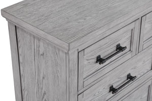  featuring a soft greige finish that highlights the natural wood grain. The sturdy bed stands as the centerpiece with its robust headboard and inviting design