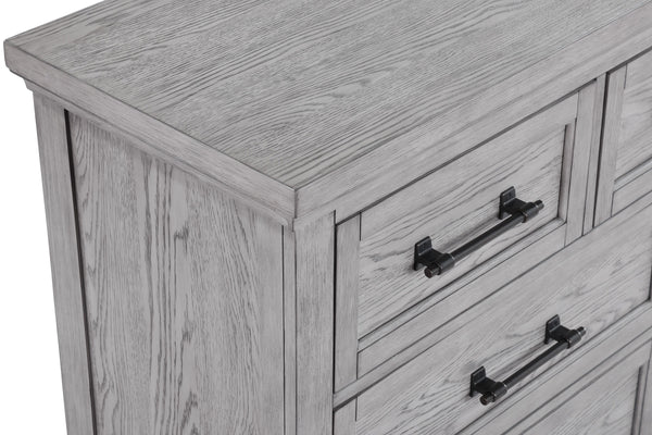  featuring a soft greige finish that highlights the natural wood grain. The sturdy bed stands as the centerpiece with its robust headboard and inviting design