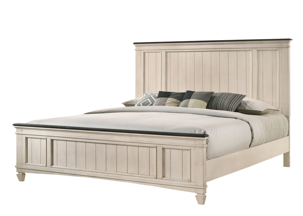 This exquisite bedroom collection epitomizes timeless elegance, with its classic silhouettes and refined antique finish. The bed, distinguished by its beautifully paneled headboard, anchors the space with its traditional charm. An integrated footboard ben