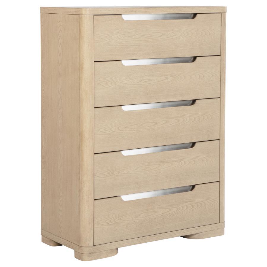This five-drawer chest offers a balance of style and storage with its light elm finish and brushed nickel fingertip pulls. Rounded corners enhance its sleek design, while extra-large tinted drawers provide ample storage. Built with French dovetail fronts,