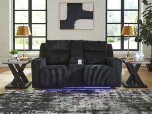  meet irresistible modern function. Your living room gets a cozy-cool upgrade with the TwinBrooke power reclining loveseat. Curl up in its ultra-chic corded upholstery and recline with one-touch controls. Is it movie night or game time? 