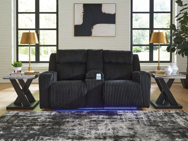  meet irresistible modern function. Your living room gets a cozy-cool upgrade with the TwinBrooke power reclining loveseat. Curl up in its ultra-chic corded upholstery and recline with one-touch controls. Is it movie night or game time? 