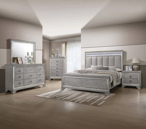 This elegant bedroom suite combines timeless design with contemporary appeal. The soft gray finish offers a modern twist on classic styling, with integrated LED lighting on the tufted headboard adding a luxurious focal point. The collection includes a bed