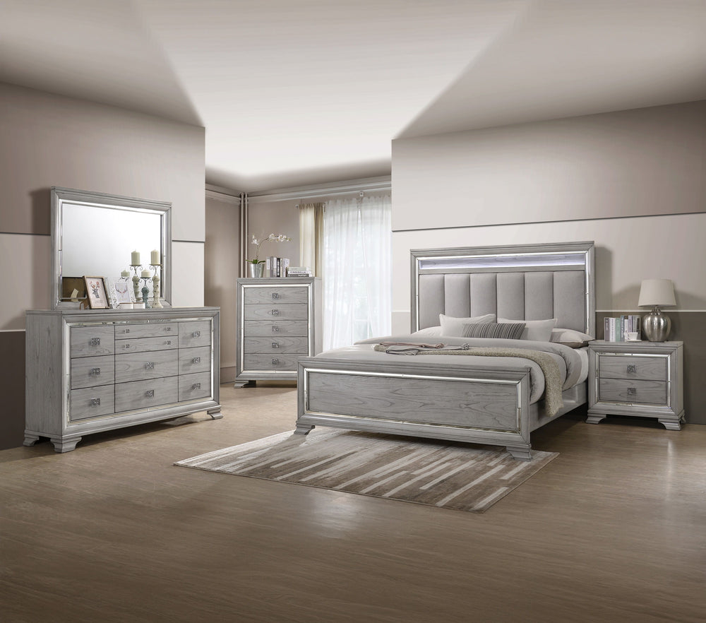 This elegant bedroom suite combines timeless design with contemporary appeal. The soft gray finish offers a modern twist on classic styling, with integrated LED lighting on the tufted headboard adding a luxurious focal point. The collection includes a bed