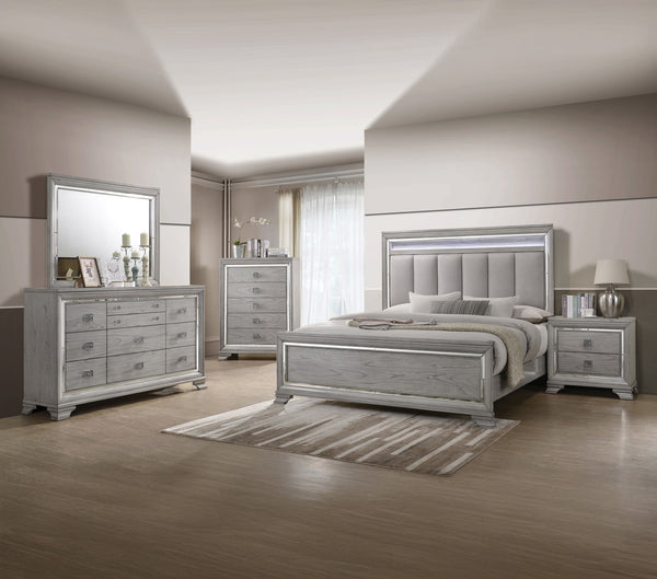 This elegant bedroom suite combines timeless design with contemporary appeal. The soft gray finish offers a modern twist on classic styling, with integrated LED lighting on the tufted headboard adding a luxurious focal point. The collection includes a bed