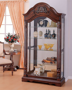 The Denton Curio Cabinet will add beauty and design to any room. This detailed and stylish cabinet has tempered glass doors and shelves and is uniquely designed to be a welcome addition to your decorative collection.Â This sophisticated cabinet in a warm 