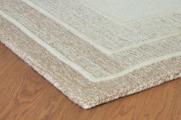  this hand-tufted rug brings a touch of casual elegance to your abode. Its plush wool pile feels luxuriously soft underfootâ€”perfect for adding warmth and texture to your entertainment area