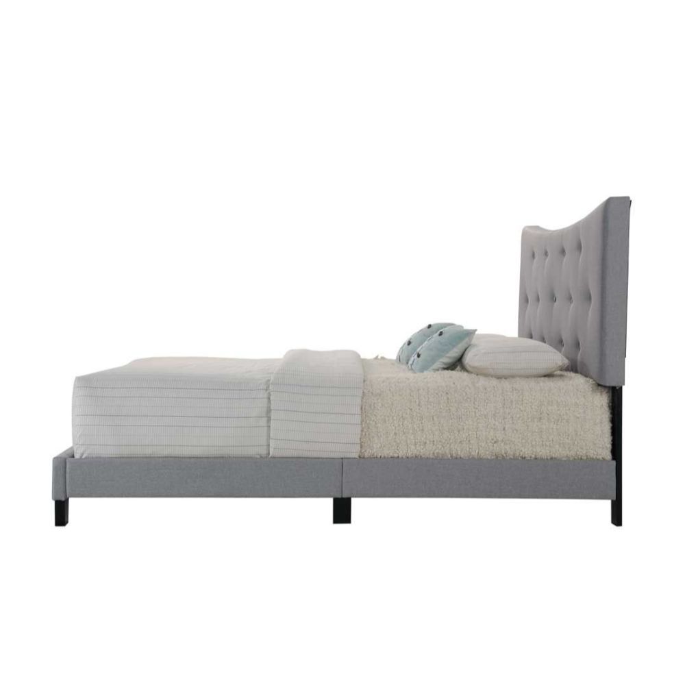 The Venecha platform bed is stunning with its soft concave arch in the headboard that also features button tufting. The side rails and platform footboard are also wrapped in the gray fabric and supported by wood feet and headboard posts. This bed would wo