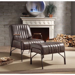  the Sarahi is supported by airy metal curved armrests and legs. Vertical stitchi