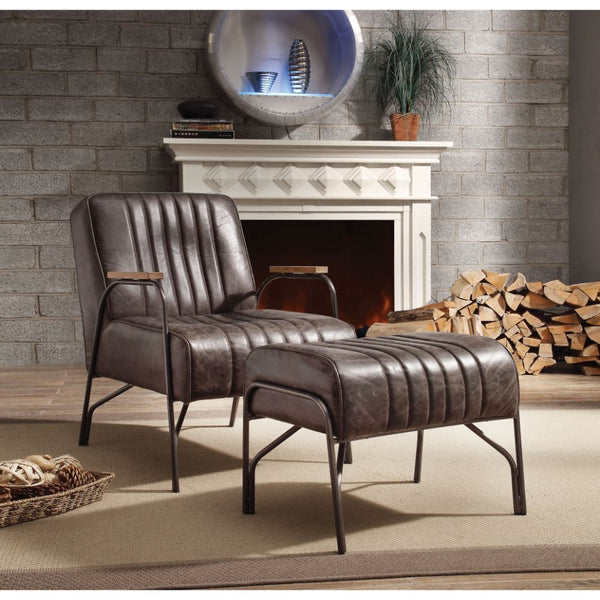  the Sarahi is supported by airy metal curved armrests and legs. Vertical stitchi