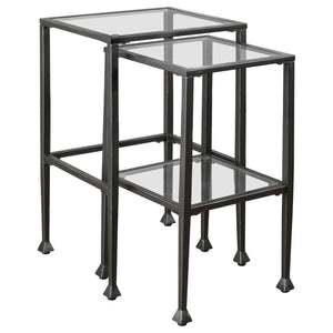 This two-piece nesting table set features sleek, modern design with clear tempered glass tops and shelves. The black powder-coated metal frame ensures durability and stability while enhancing the contemporary look of your living space. Perfect for compact